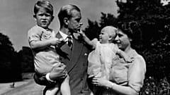 In this August 1951 photo, Princess Elizabeth stands with her husband Prince Philip, the Duke of Edinburgh, and their children Prince Charles and Princess Anne