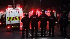 Police form a line to separate Nationalists from attacking each other in North Belfast, Northern Ireland, April 9, 2021. 