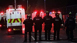Police form a line to separate Nationalists from attacking each other in North Belfast, Northern Ireland, April 9, 2021. 