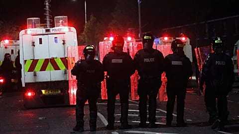 Police form a line to separate Nationalists from attacking each other in North Belfast, Northern Ireland, April 9, 2021. 