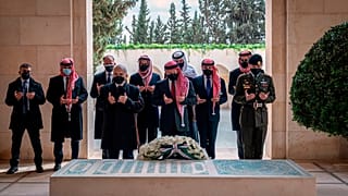 Jordan’s King Abdullah II, center, Prince Hamzah bin Al Hussein, second left, and others visit the tomb of the late King Hussein, in Amman Jordan. April 11, 2021.