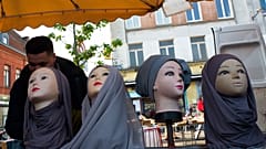 Mannequins present Muslim veils at an open air market in Lille.