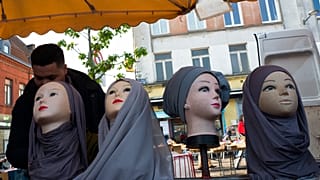 Mannequins present Muslim veils at an open air market in Lille.