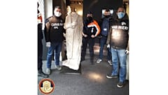 Italian antiquities police the Carabinieri Art Squad with the recovered statue in Brussels