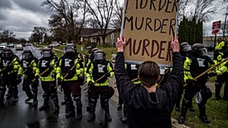 Protesters confronted police over the shooting death of Daunte Wright at a rally at the Brooklyn Center Police Department in Brooklyn Center, Minn., Monday, April 12, 2021.