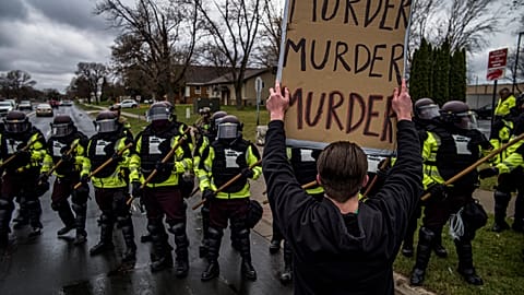 Protesters confronted police over the shooting death of Daunte Wright at a rally at the Brooklyn Center Police Department in Brooklyn Center, Minn., Monday, April 12, 2021.