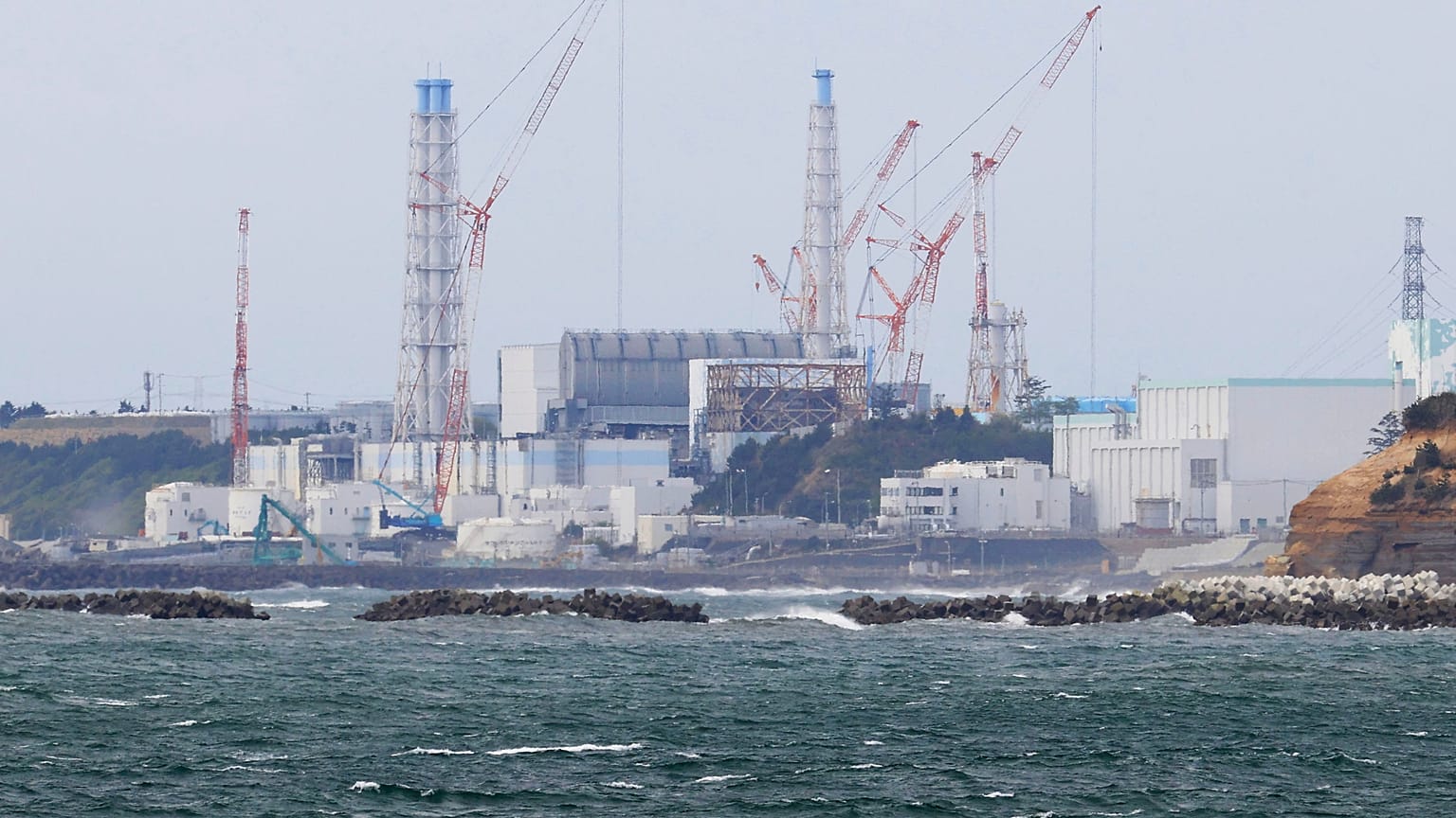 Fukushima Daiichi nuclear power plant is seen from Namie town, Fukushima prefecture, north of Tokyo, Tuesday, April 13, 2021. 