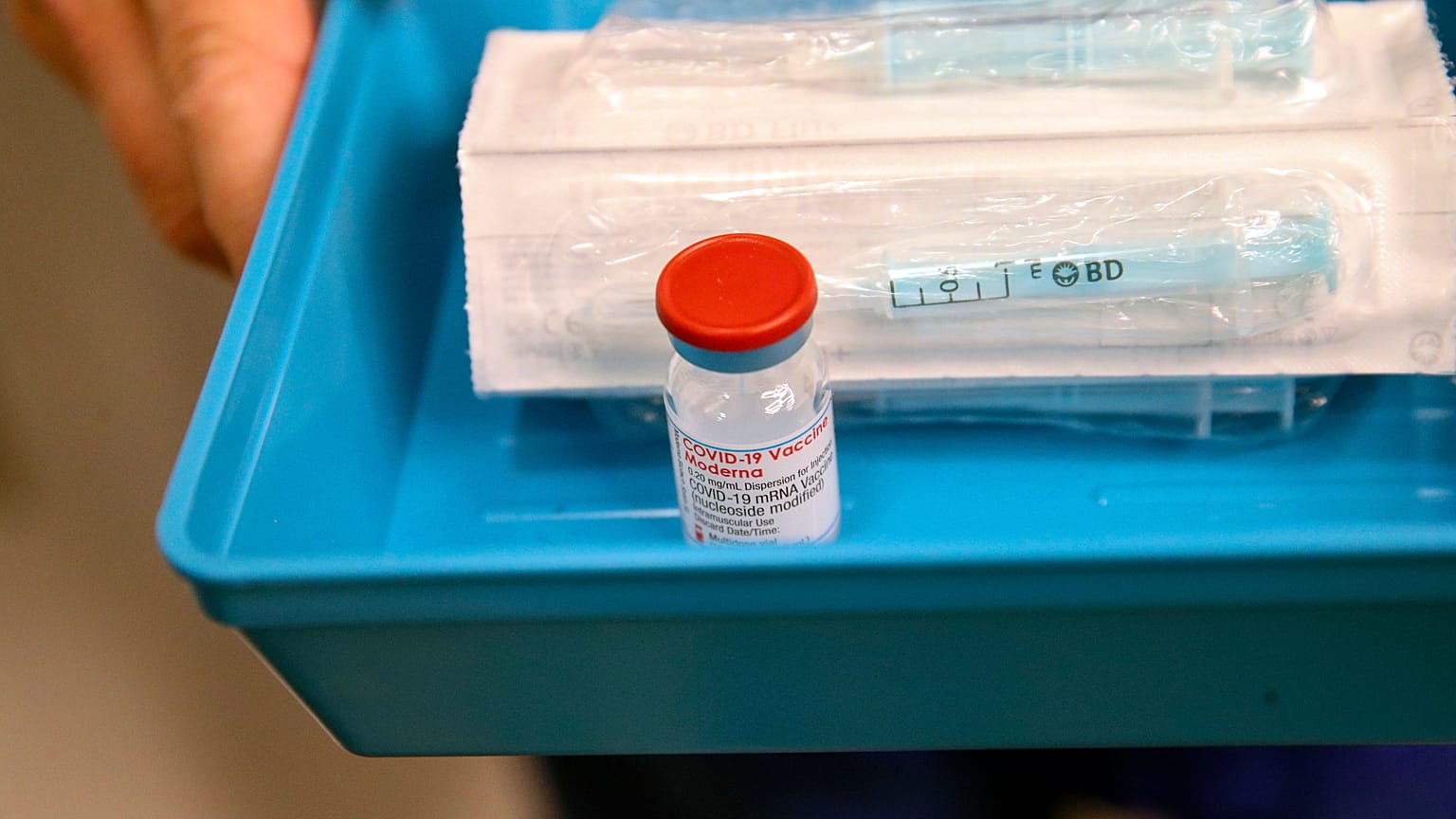 The Moderna Covid-19 vaccine is prepared at the vaccination centre, at the Madejski Stadium in Reading, England, April 13, 2021.
