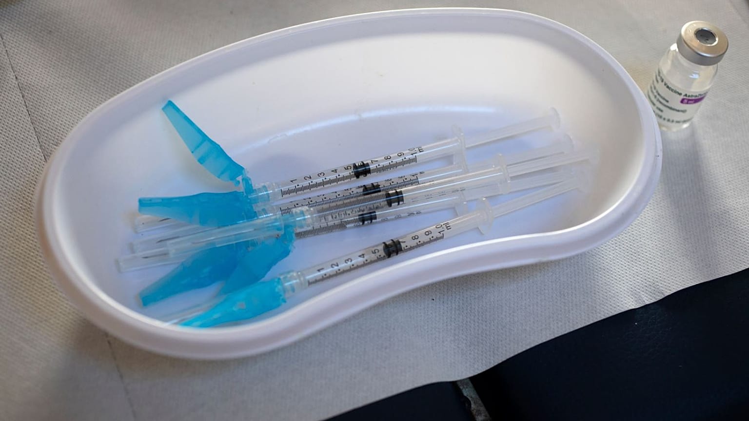 Syringes and a vial of the AstraZeneca vaccine sit on a general practitioners' table in Amsterdam.
