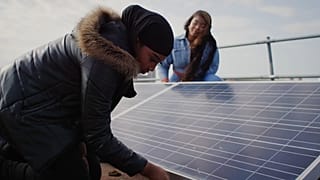 Locals buiding their solar power grid in Brixton, UK