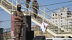 Houthi fighters stand guard during a rally marking six years for a Saudi-led coalition in Sanaa, Yemen