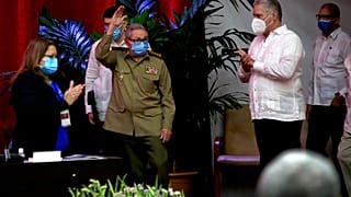 Raul Castro, first secretary of the Communist Party and former president, waves to members at the Congress of the Communist Party of Cuba's opening session, April 16, 2021