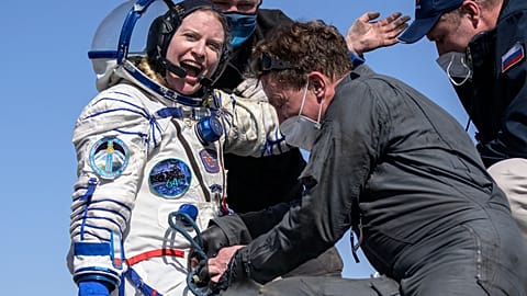 Expedition 64 NASA astronaut Kate Rubins is helped out of the Soyuz MS-17 spacecraft 