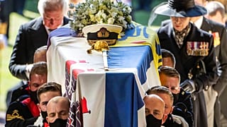 Pallbearers carry the coffin of the Duke of Edinburgh, followed by the Prince of Wales and Princess Anne, right, into St George's Chapel for his funeral at Windsor Castle
