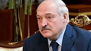 Belarusian President Alexander Lukashenko listens to Russian Prime Minister Mikhail Mishustin during their talks in Minsk, Belarus, April 16, 2021.
