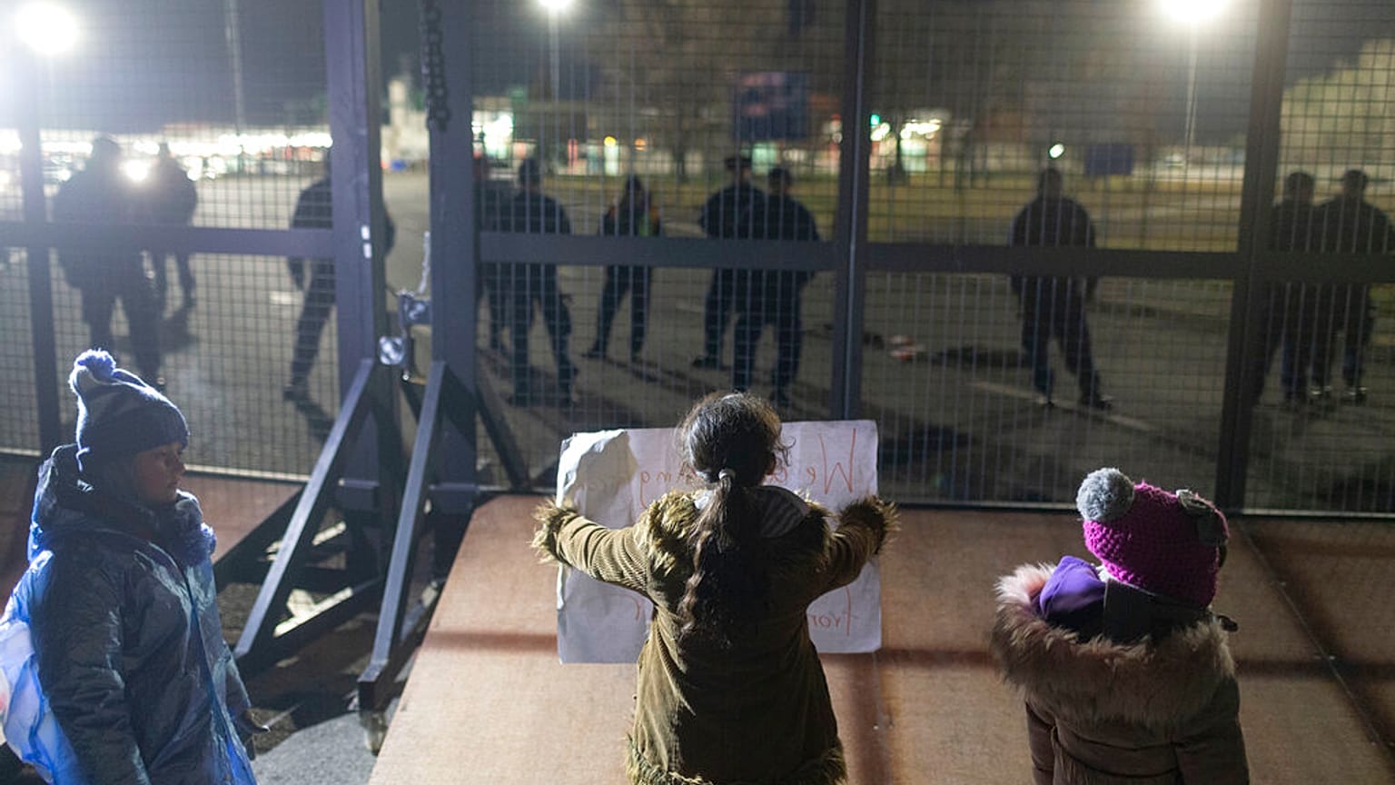 Children stand at the border line between Serbia and Hungary in Kelebija, Serbia, in February 2020