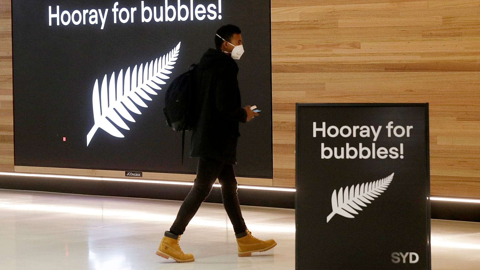 A passenger at Sydney Airport to catch a flight to New Zealand, Monday, April 19, 2021,
