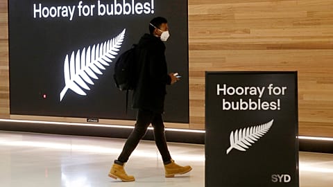 A passenger at Sydney Airport to catch a flight to New Zealand, Monday, April 19, 2021,