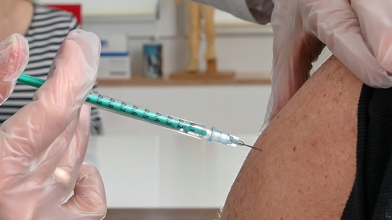 A patient receives the AstraZeneca vaccine in Germany