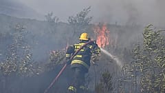 A fire rages on the slopes of Table Mountain, in Cape Town South Africa.