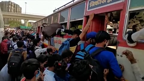 Workers trying to get in buses 