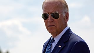 Joe Biden joined by his family members walk along the national road named after his late son in the village of Sojevo, Kosovo, on Wednesday, Aug. 17, 2016.