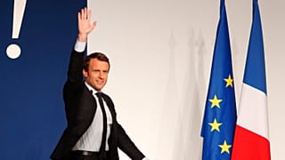 Then-presidential candidate Emmanuel Macron waves to the crowd during a campaign rally in Chatellerault, central France, Friday, April 28, 2017.