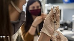 Primary care pharmacist fills syringe with the Janssen Vaccine
