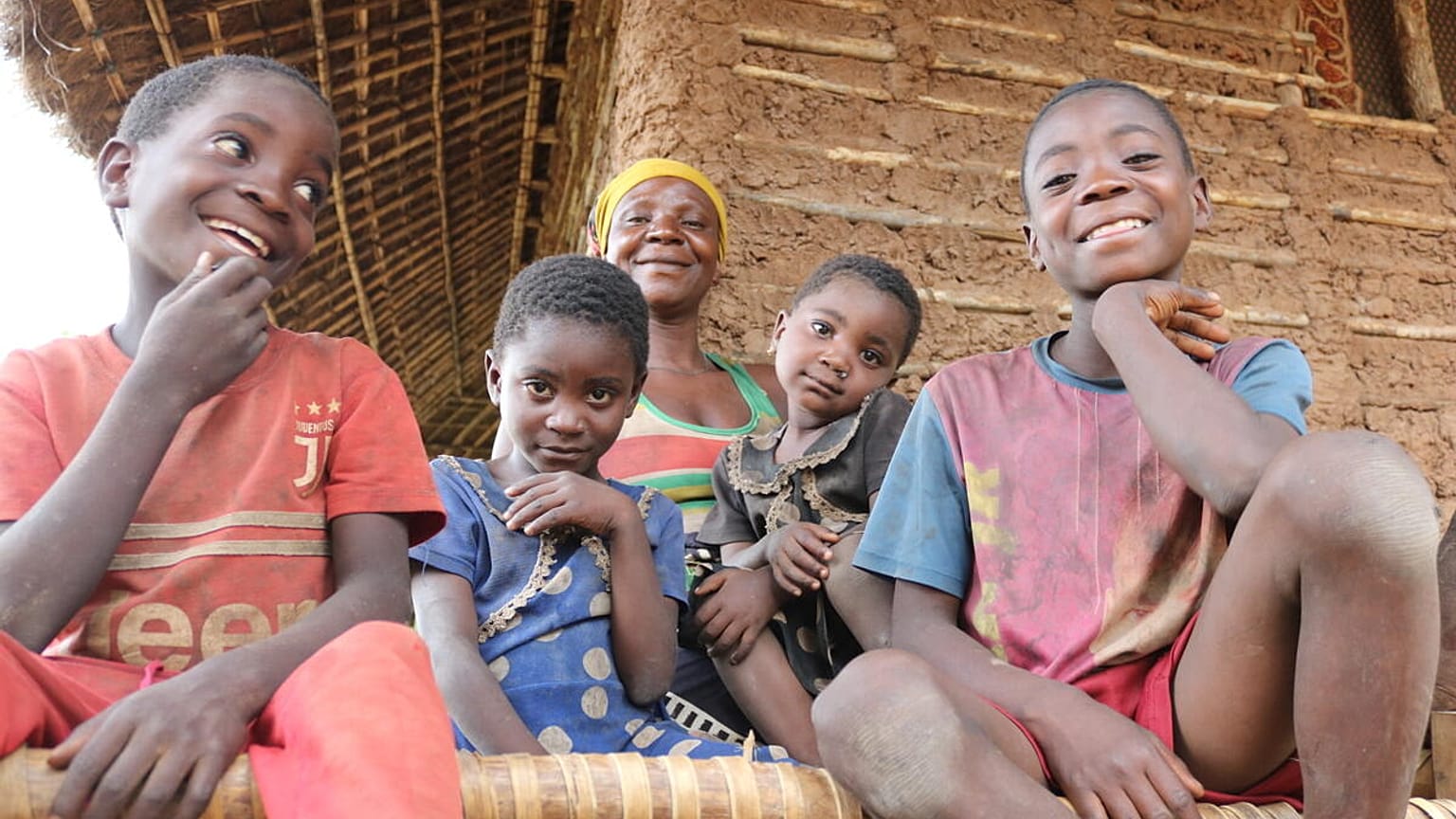 Filomena (central) with her children Felicio, Admira, Ergilia and Baptista outside their home in Cabo Delgado, Mozambique.