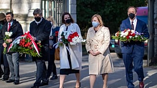 Belarus opposition leader Sviatlana Tsikhanouskaya, centre, and U.S. Ambassador to Belarus Julie Fisher attend a memorial service for Chernobyl victims in Vilnius, Lithuania