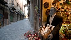 Via San Gregorio Armeno, famous for its statuettes, is empty, in downtown Naples, southern Italy, Wednesday, March 11, 2020. 