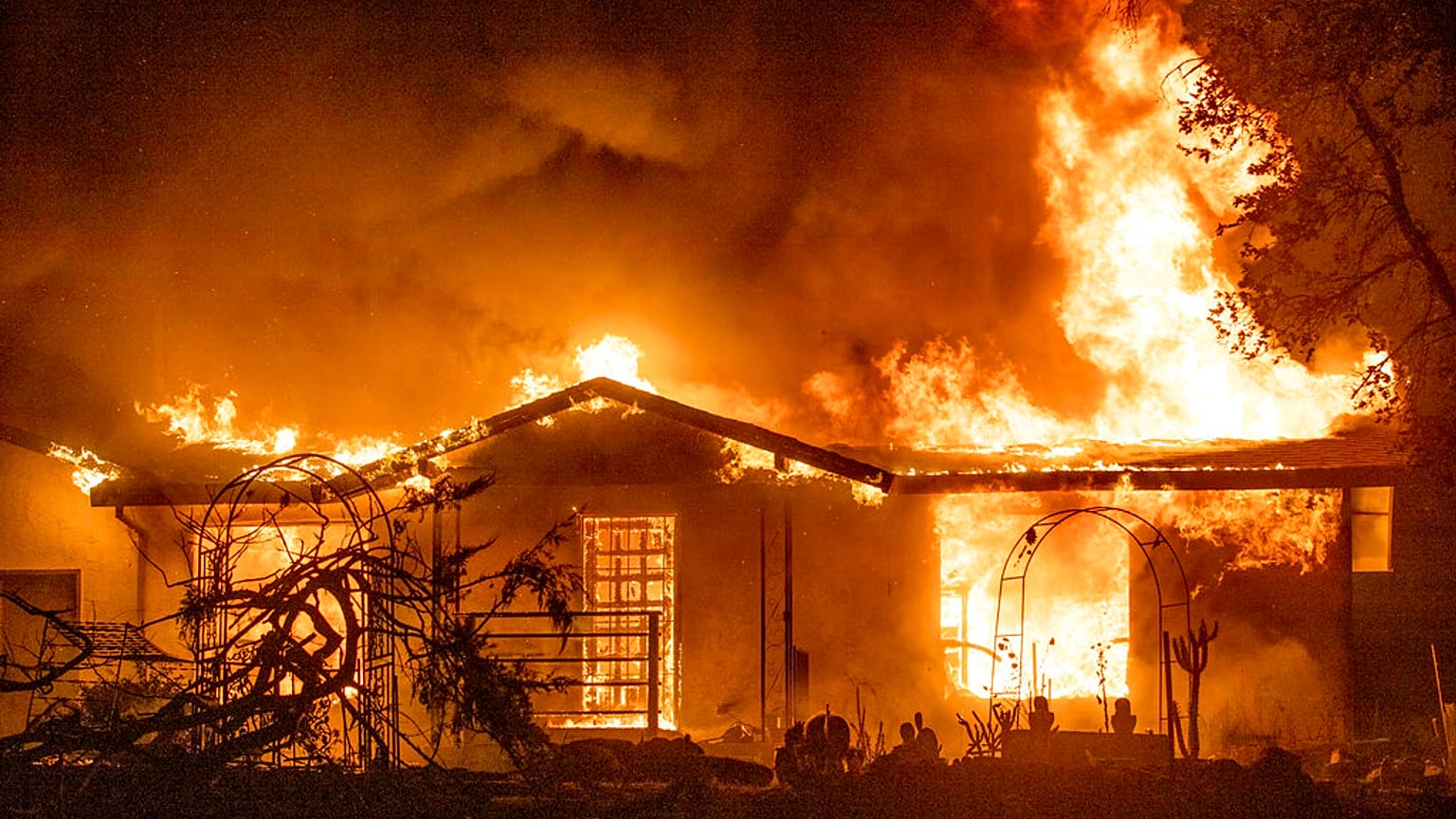 Sept. 27, 2020, a house burns at the Zogg Fire near Ono, Calif. California 