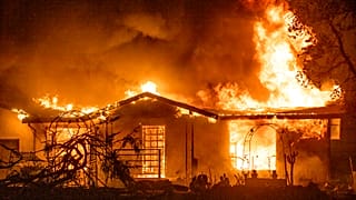Sept. 27, 2020, a house burns at the Zogg Fire near Ono, Calif. California
