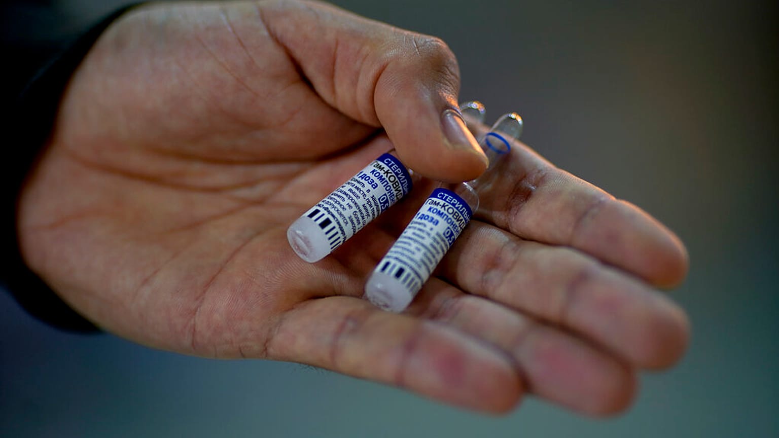 A volunteer vials of the Sputnik V COVID-19 vaccine