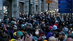 People light their phones during the opposition rally in support of jailed opposition leader Alexei Navalny in Moscow, Russia, Wednesday, April 21, 2021.