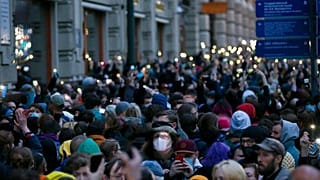 People light their phones during the opposition rally in support of jailed opposition leader Alexei Navalny in Moscow, Russia, Wednesday, April 21, 2021.