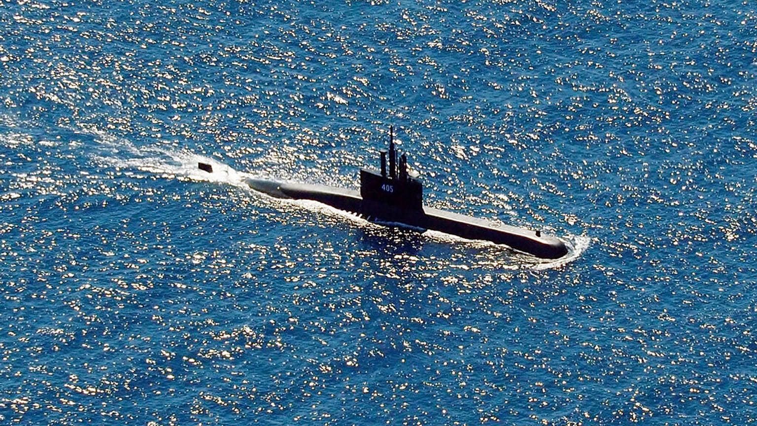 Indonesia's navy ships on Thursday were intensely searching for the submarine that likely fell too deep to retrieve, making survival chances for all the crew on board slim. 