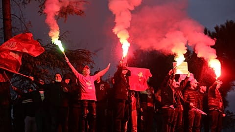 Supporters of the Socialist Movement for Integration (LSI) hold flares during a rally of their party in Tirana, Albania, Thursday, April 22, 2021.