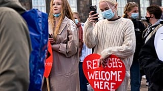 People attend a demonstration against the tightening of Denmark's migration policy and the deportation orders in Copenhagen, Denmark, April 21, 2021. 