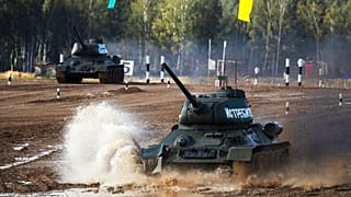 Soviet tanks T-34 perform during the International Military Technical Forum Army-2020 in Alabino, outside Moscow, Russia, Sunday, Aug. 23, 2020.