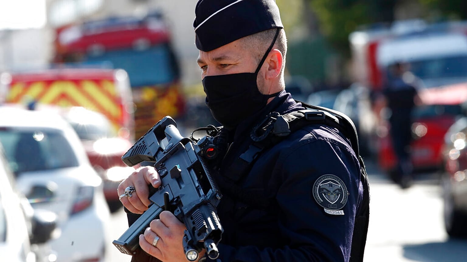 Police officers block the access next to the Police station in Rambouillet, south west of Paris, Friday, April 23, 2021.