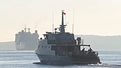 An Indonesian navy patrol ship sails to join the search for submarine KRI Nanggala that went missing while participating in a training exercise on Wednesday, off Banyuwangi.
