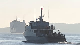 An Indonesian navy patrol ship sails to join the search for submarine KRI Nanggala that went missing while participating in a training exercise on Wednesday, off Banyuwangi.