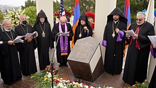 Religious leaders sing at a ceremony at the Montebello Armenian Genocide Monument in Montebello, Calif., Saturday, April 24, 2