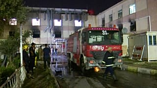 First responders work the scene of a hospital fire in Baghdad on Saturday, April 24, 2021
