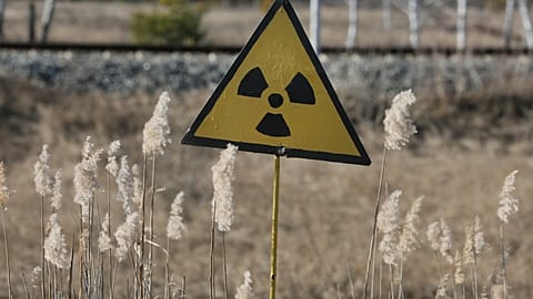 A radiation sign outside the deserted town of Pripyat, some 3 kilometers (1.86 miles) from the Chernobyl nuclear power plant in Ukraine, Tuesday, Feb. 4, 2020