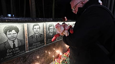 A man reacts at the monument to Chernobyl victims in Slavutych, the city where the power station's personnel lived, some 50 kilometres (30 miles) from the accident site