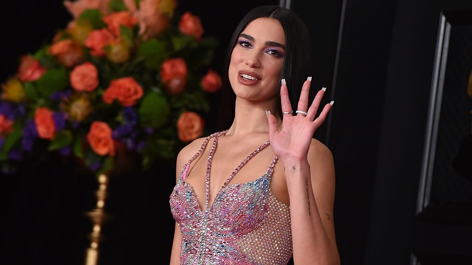 Dua Lipa called for a pay rise for UK healthcare workers at the 2021 BRIT Awards. In this Sunday, 14 March, 2021 file photo she arrives at the 63rd annual Grammy Awards.