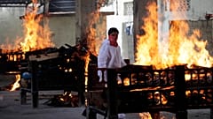 Flames rise from cremation pyres of victims of a fire that broke out in Vijay Vallabh COVID-19 hospital, at Virar, near Mumbai, India, Friday, April 23, 2021.