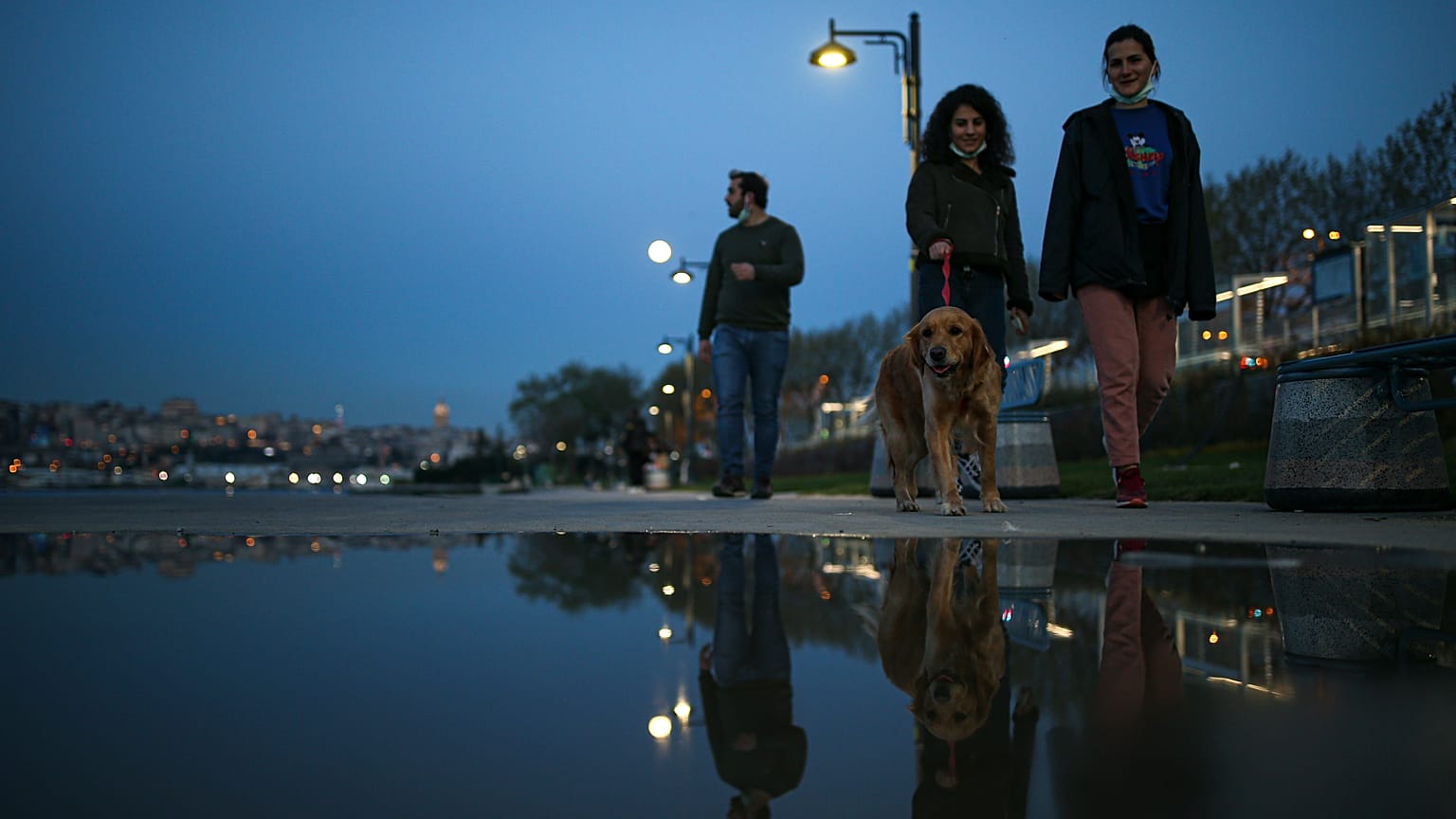 People walk in central Istanbul, Monday, April 26, 2021. 